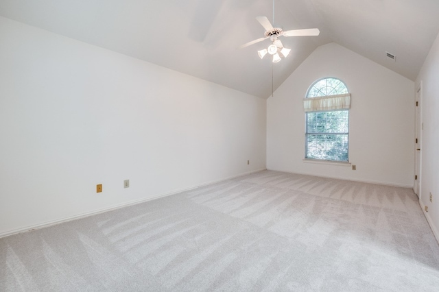 carpeted empty room with ceiling fan and vaulted ceiling