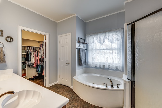 bathroom featuring vanity, separate shower and tub, and crown molding