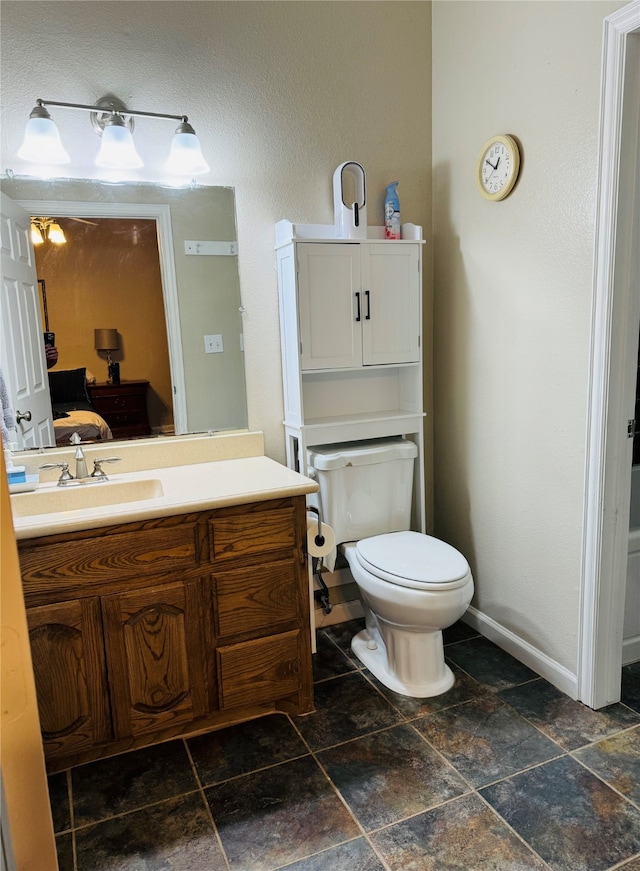 bathroom with vanity and toilet