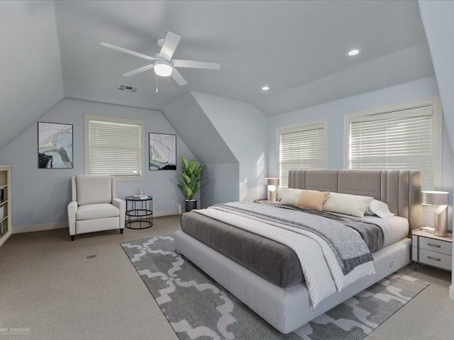 bedroom featuring light carpet, vaulted ceiling, and ceiling fan