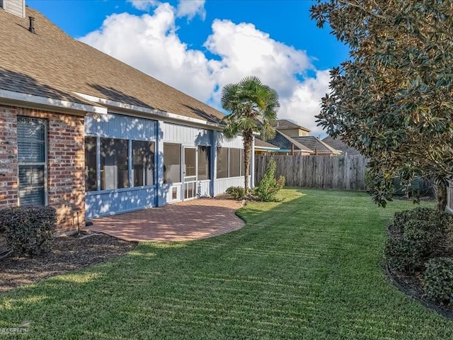 view of yard with a sunroom