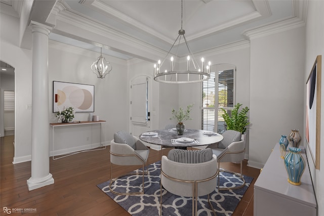 dining area featuring decorative columns, crown molding, dark wood-type flooring, and a raised ceiling