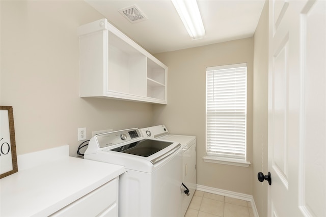 washroom featuring light tile patterned floors and independent washer and dryer