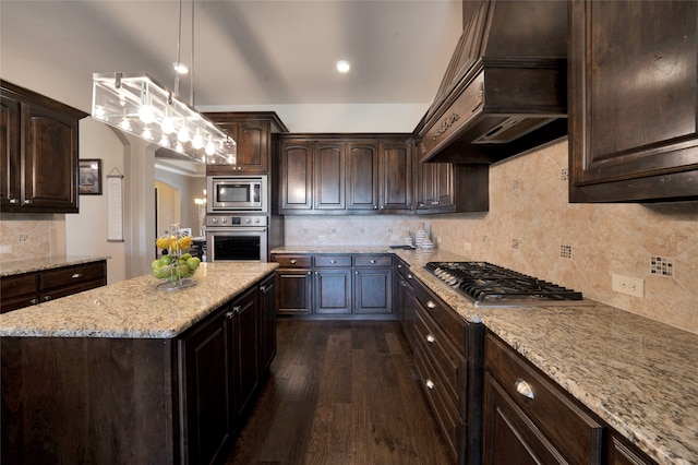 kitchen featuring hanging light fixtures, tasteful backsplash, stainless steel appliances, dark hardwood / wood-style floors, and custom range hood