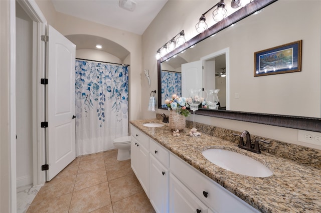 bathroom featuring tile patterned floors, vanity, toilet, and a shower with curtain