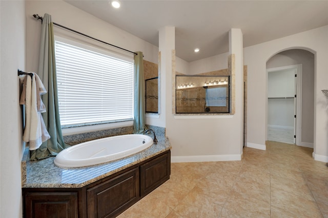 bathroom featuring tile patterned floors and plus walk in shower