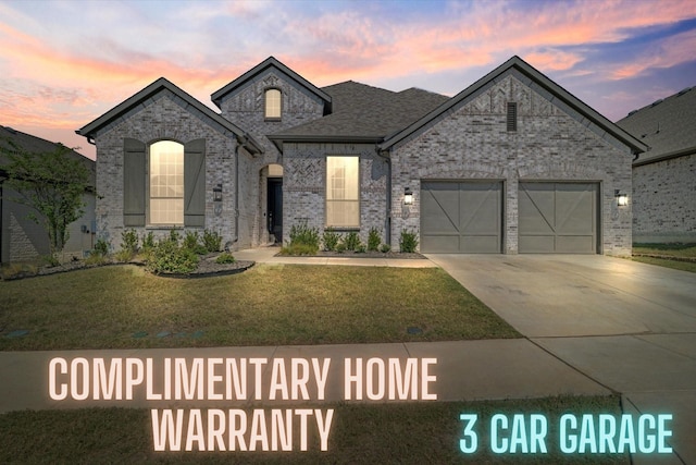 417 Sunnyridge Ln, Little Elm, TX 76227 - view of front of home with a front yard, driveway, a garage, and brick siding