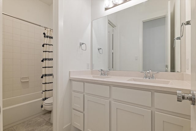 bathroom with a sink, shower / bathtub combination with curtain, toilet, and double vanity