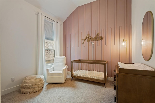 sitting room featuring baseboards, lofted ceiling, and carpet floors