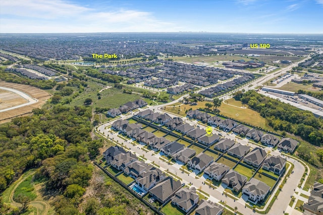 birds eye view of property with a residential view