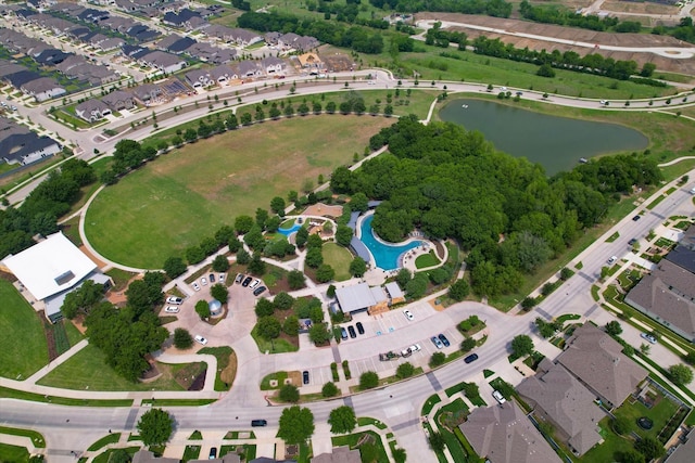 birds eye view of property with a residential view and a water view