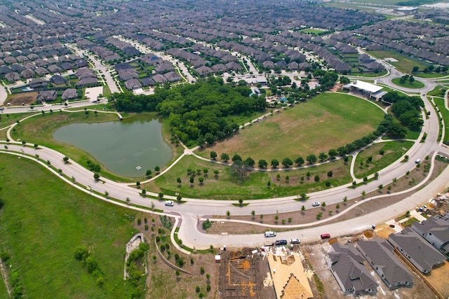 drone / aerial view with a residential view and a water view