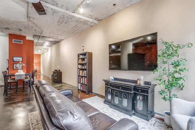 living room with concrete flooring