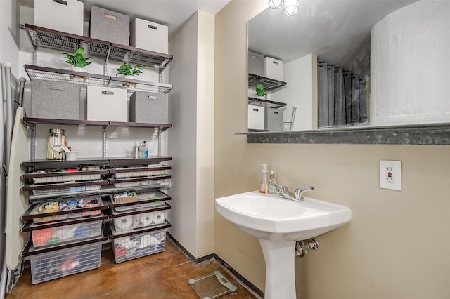 bathroom with concrete floors