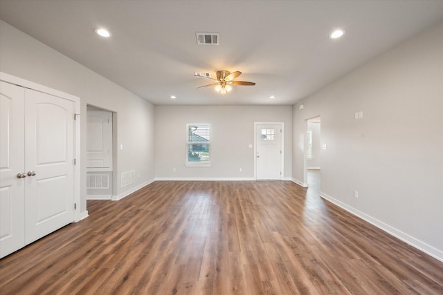 interior space featuring ceiling fan and dark hardwood / wood-style flooring