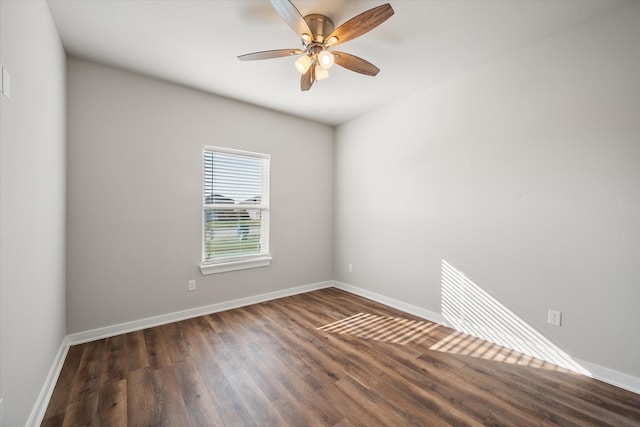 unfurnished room featuring ceiling fan and dark hardwood / wood-style flooring