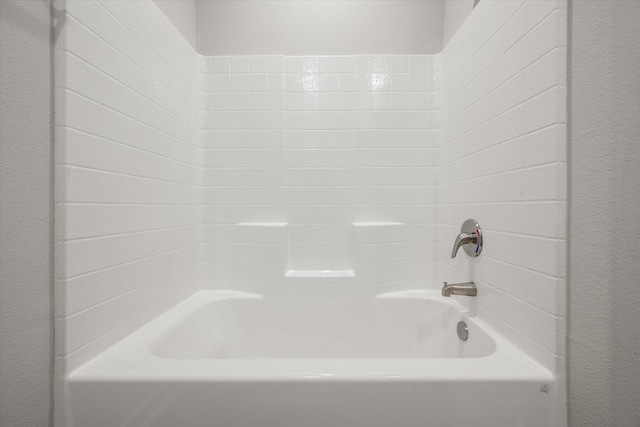 bathroom with shower / washtub combination