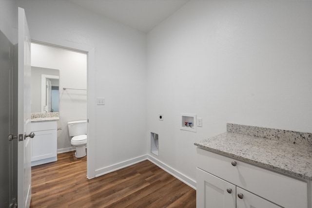 laundry room with hookup for an electric dryer, hookup for a washing machine, dark hardwood / wood-style flooring, and cabinets