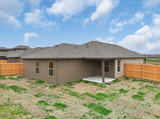 back of house with a patio area