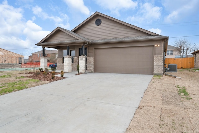ranch-style house with a garage, central AC, fence, brick siding, and driveway