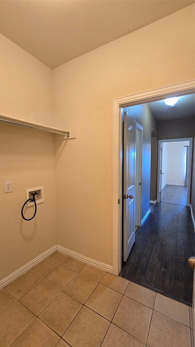 washroom featuring hookup for a washing machine and tile patterned floors