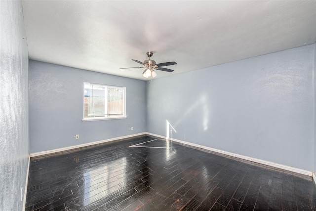 unfurnished room with ceiling fan and wood-type flooring