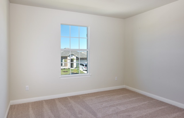 empty room featuring carpet and a healthy amount of sunlight