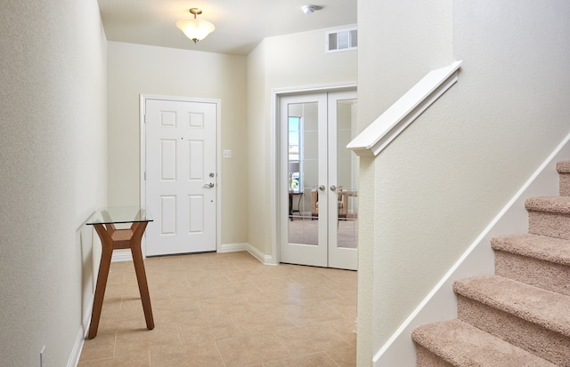 entrance foyer featuring french doors