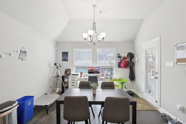 dining area with an inviting chandelier, lofted ceiling, and dark wood-type flooring