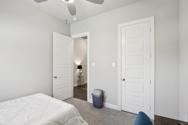 carpeted bedroom with ceiling fan