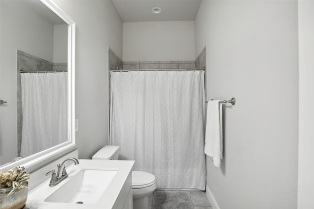 bathroom featuring tile patterned floors, a shower with shower curtain, vanity, and toilet