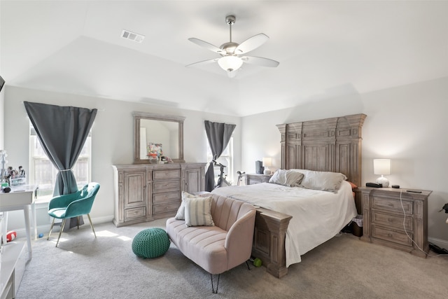 bedroom featuring lofted ceiling, ceiling fan, and light colored carpet