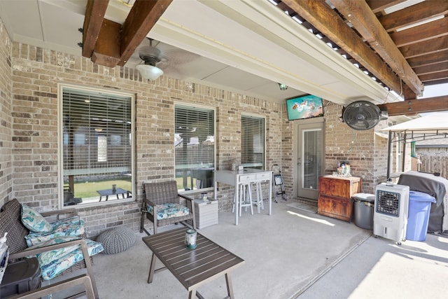 view of patio featuring ceiling fan