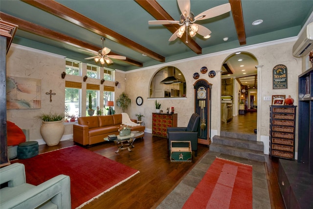 living room featuring dark hardwood / wood-style floors, beam ceiling, a wall unit AC, and ceiling fan