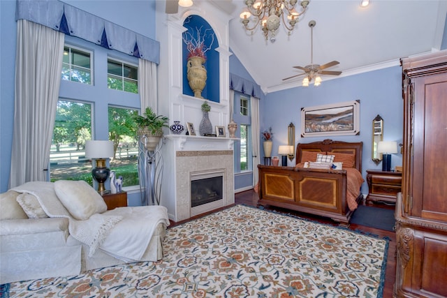 bedroom with a fireplace, high vaulted ceiling, hardwood / wood-style flooring, and multiple windows