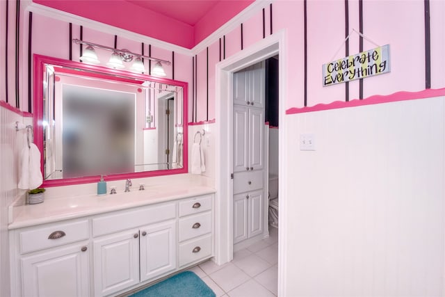 bathroom with vanity, tile patterned flooring, and toilet