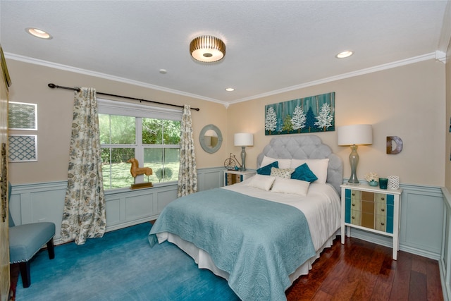 bedroom with dark hardwood / wood-style floors and crown molding