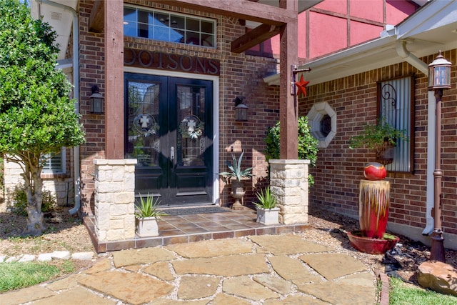 view of exterior entry featuring french doors