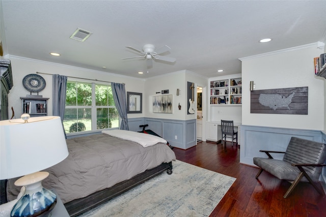 bedroom with ornamental molding, dark hardwood / wood-style flooring, and ceiling fan