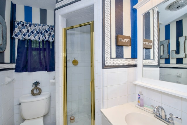 bathroom featuring vanity, tile walls, toilet, and an enclosed shower