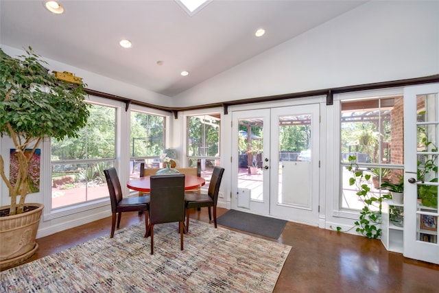 dining area featuring french doors and high vaulted ceiling