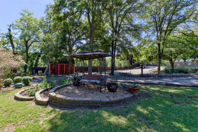 view of yard with a gazebo and a shed