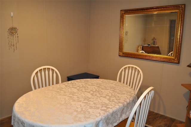 dining area with dark hardwood / wood-style floors