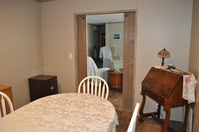 dining area with hardwood / wood-style flooring