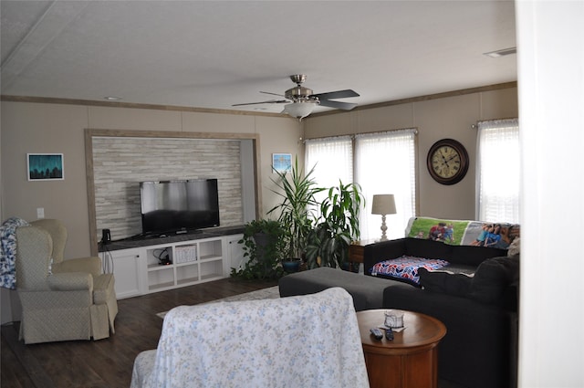 living room featuring ceiling fan, dark hardwood / wood-style floors, and ornamental molding