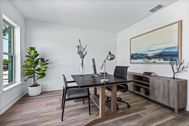 home office with hardwood / wood-style flooring