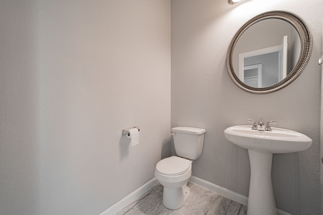 bathroom with sink and toilet