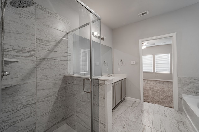 bathroom with vanity, ceiling fan, and plus walk in shower