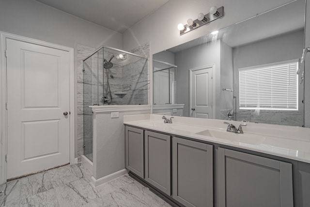 bathroom featuring vanity and an enclosed shower