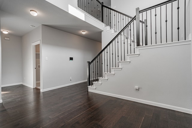 stairs with hardwood / wood-style floors